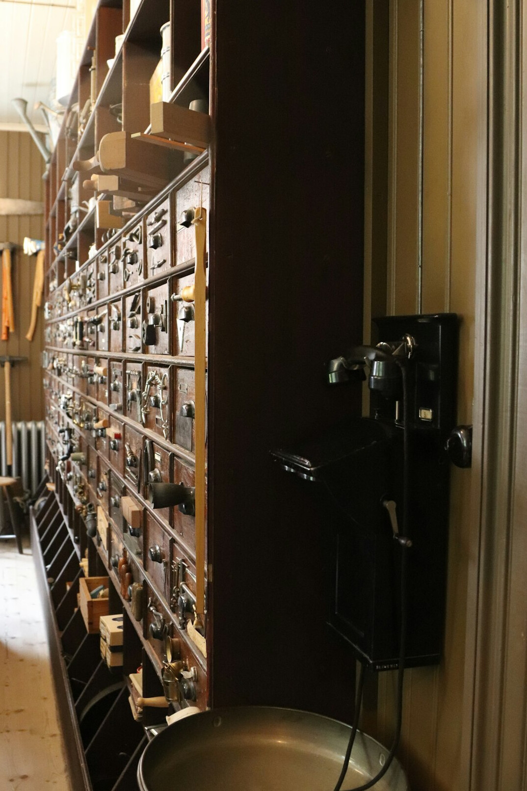 Shelves of archived film reels and paper folders in a media archive